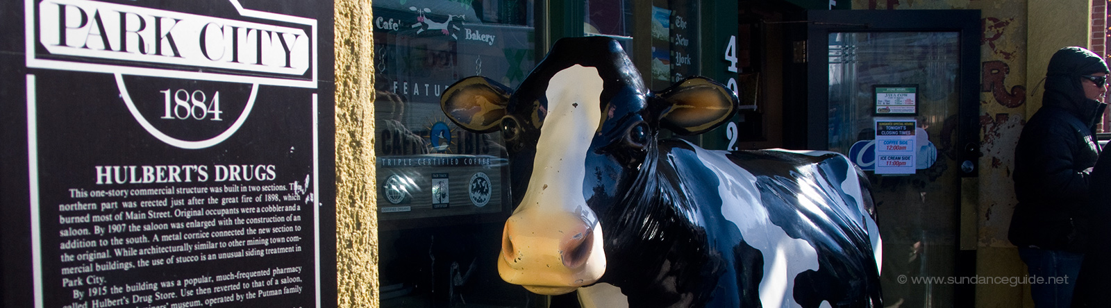 A picture of a cow sculpture on the street in Park City, Utah